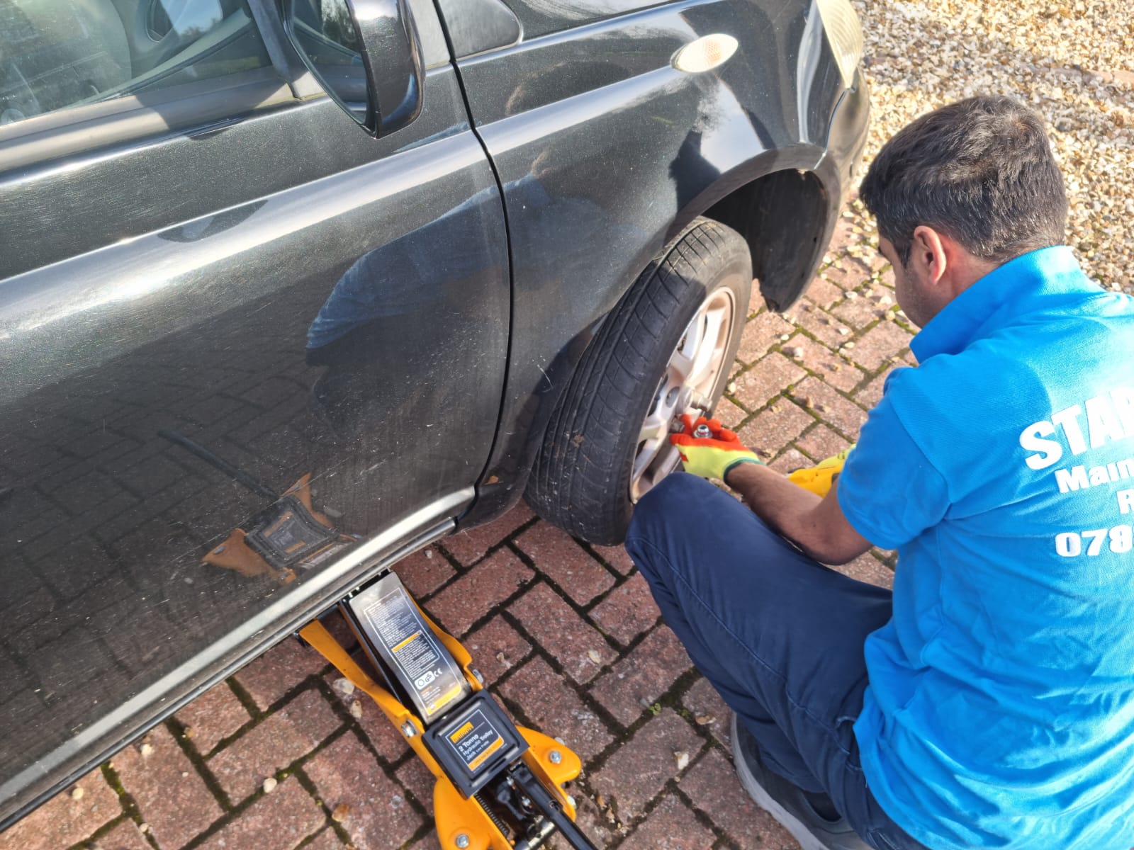 Star Tyres technician professionally fitting a wheel